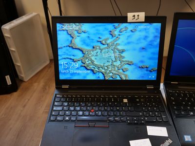 two laptops that are sitting on a table