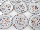 many plates with different designs on them on a table