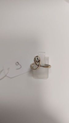 a ring that is sitting on top of a piece of paper