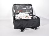 a black suitcase with a bunch of items inside of it