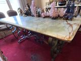 a table with a marble top and chairs in a room