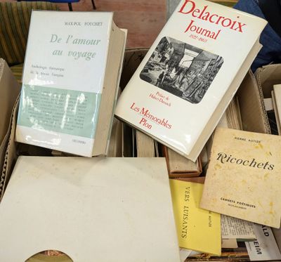 several books are stacked on top of each other on a table