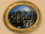 une image d'un tableau représentant un paysage dans un cadre doré