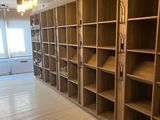 a room with a lot of bookshelves in it