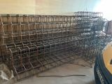 a pile of metal cages sitting on the floor