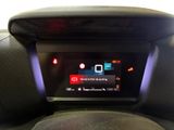 the dashboard of a car with a digital display in the center