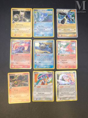 the pokemon cards are lined up on a black surface