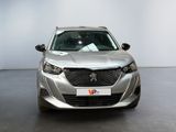 the front view of a silver car parked in a showroom
