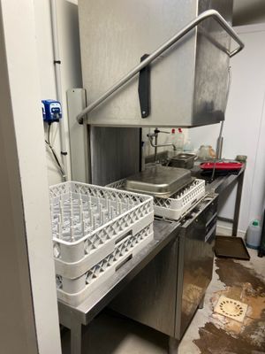 a kitchen with a sink and a dishwasher in it