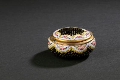 an image of a decorative box on a black surface