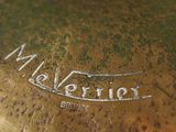 a close up of a metal plate with a logo on it
