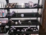a display of makeup products in the corner of the room