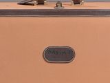 a tan suitcase with a brown handle on a white surface