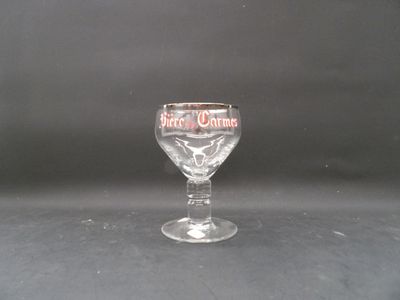a wine glass that is sitting on a table