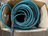 a box with a bunch of blue hoses inside of it