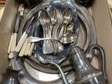 a box full of silverware sitting on a table