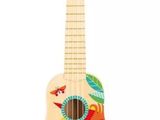 a wooden ukule with a bird design on it
