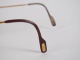 an image of a pair of glasses sitting on top of a white surface