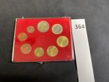 a close up of a red box with gold coins in it