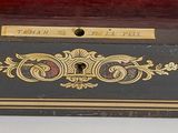 an image of a wooden box with a key in it