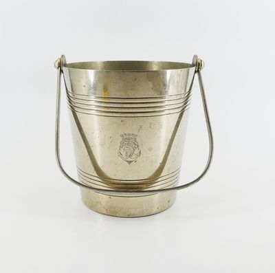 an antique silver plated ice bucket with handles on a white background