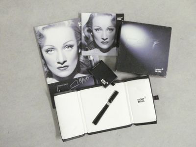 a black and white photo of marilyn monroe with a pen