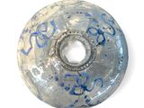 an image of a donut with blue splatters on it