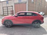 a red suv parked in front of a building