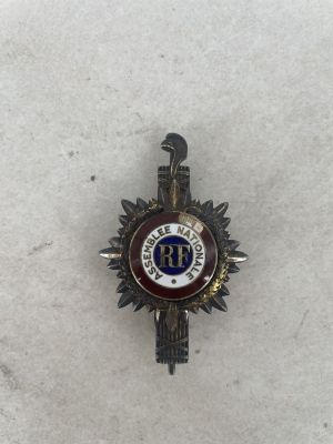 an image of a badge with a bird on it