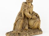 an image of a statue of a man sitting on top of a sheep