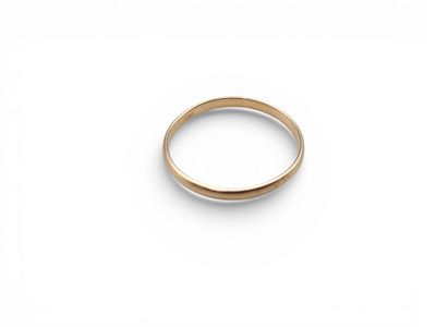 a close up of a gold ring on a white surface