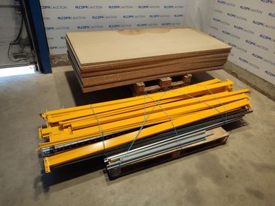 several pieces of wood are stacked on a pallet in a warehouse