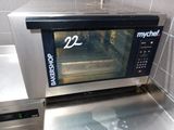 a small oven that is sitting in a kitchen