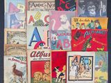 a lot of children ' s books on display on the wall