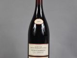 a bottle of wine that is sitting on a table