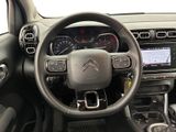 the interior of a car with a steering wheel and dashboard controls