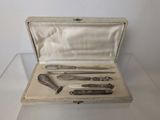 a silver case with a set of tools inside of it