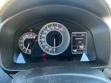 a close up of a car dashboard with a speedometer and gauges