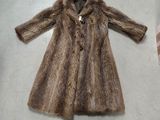 a picture of a brown fur coat on a table