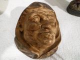 a statue of a man with a hat on a table