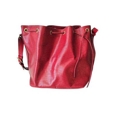 red leather bucket bag on white background with clipping for text