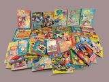 a lot of comics and books on the table