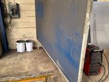 a picture of a picture of a large screen in a garage