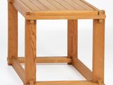 the side table is made of wood and has a square top