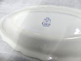 a white bowl with a blue logo on it