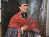 un vieux tableau représentant un homme tenant une croix à la main