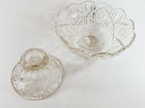 a glass bowl with a lid and a glass bowl with a lid