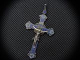 a silver cross with a blue and white enamel cross on it