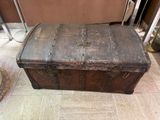 an old trunk sitting on the floor in a room