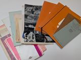 many different types of papers on a table